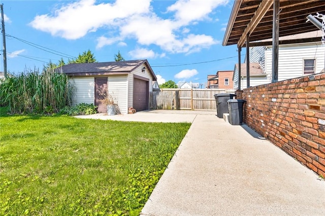1707 Maiden Ln, Springfield, OH 45504 - view of yard featuring an outbuilding, a garage, and concrete driveway