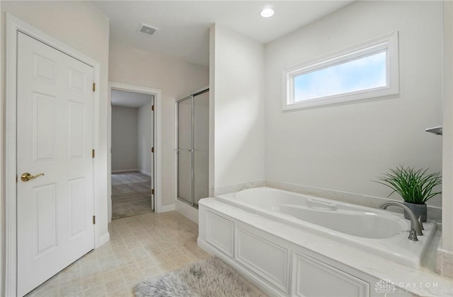 3862 Robinson Vail Rd, Franklin, OH 45005 - full bathroom featuring a garden tub and a shower stall