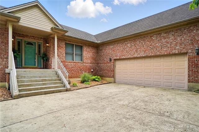 3862 Robinson Vail Rd, Franklin, OH 45005 - doorway to property with brick siding, driveway, and an attached garage