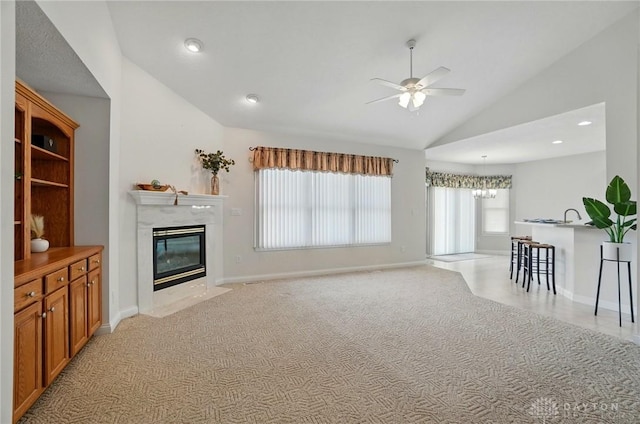 3862 Robinson Vail Rd, Franklin, OH 45005 - living room featuring lofted ceiling, a fireplace, ceiling fan, a chandelier, and light colored carpet
