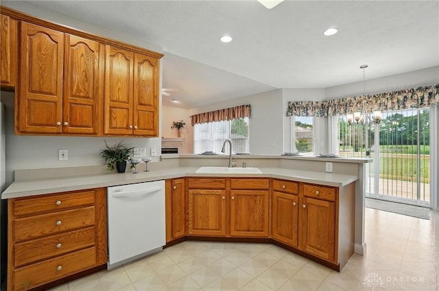 3862 Robinson Vail Rd, Franklin, OH 45005 - kitchen with white dishwasher, a peninsula, brown cabinets, light countertops, and recessed lighting