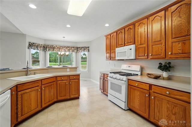 3862 Robinson Vail Rd, Franklin, OH 45005 - kitchen featuring white appliances, brown cabinetry, and recessed lighting