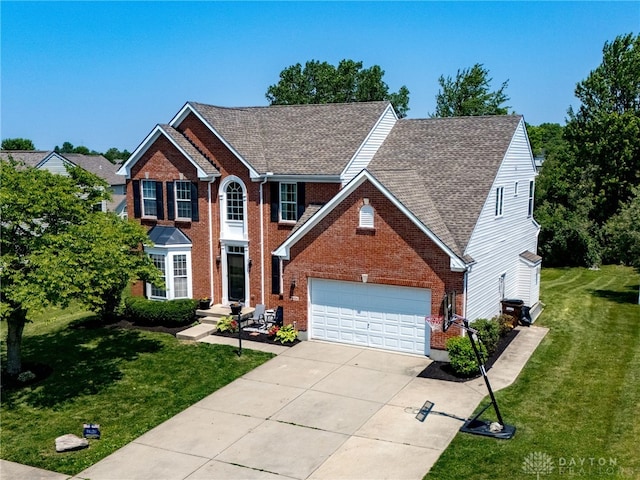 3334 Greycliff Trl, Franklin Twp, OH 45005 - view of front of property featuring driveway, a garage, brick siding, and a front lawn