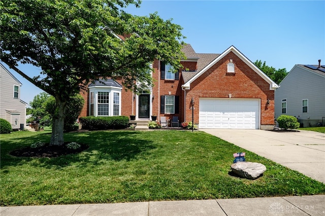 3334 Greycliff Trl, Franklin Twp, OH 45005 - view of front facade with concrete driveway, brick siding, and a front yard