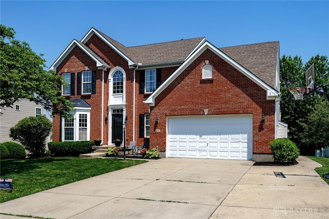3334 Greycliff Trl, Franklin Twp, OH 45005 - view of front of property featuring concrete driveway, a front yard, brick siding, and roof with shingles
