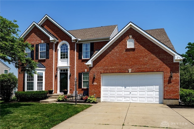 3334 Greycliff Trl, Franklin Twp, OH 45005 - view of front facade with concrete driveway, brick siding, a front lawn, and roof with shingles