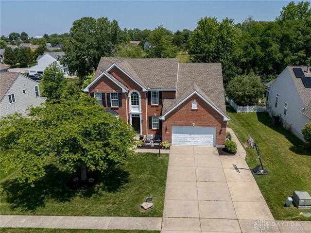 3334 Greycliff Trl, Franklin Twp, OH 45005 - colonial house with brick siding, an attached garage, driveway, a front lawn, and roof with shingles