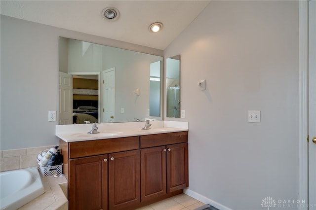 3334 Greycliff Trl, Franklin Twp, OH 45005 - full bathroom featuring lofted ceiling, double vanity, a garden tub, tile patterned floors, and a shower with door