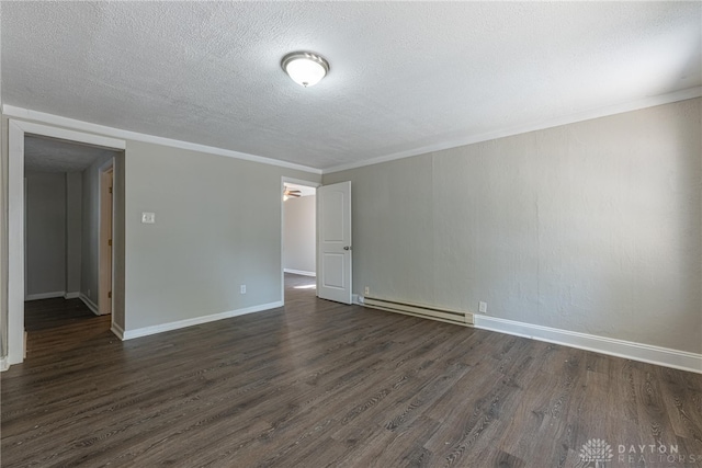 50 N Main St, Franklin, OH 45005 - empty room with baseboard heating, dark wood finished floors, and a textured ceiling