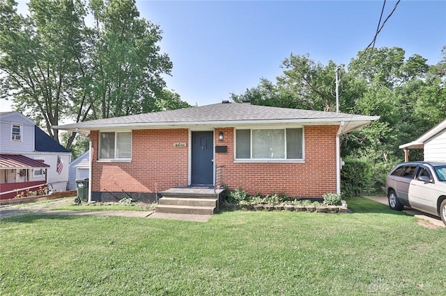 4108 Central Ave, Middletown, OH 45044 - bungalow featuring brick siding, a front lawn, and roof with shingles