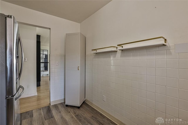 4108 Central Ave, Middletown, OH 45044 - empty room featuring tile walls, dark wood finished floors, and wainscoting