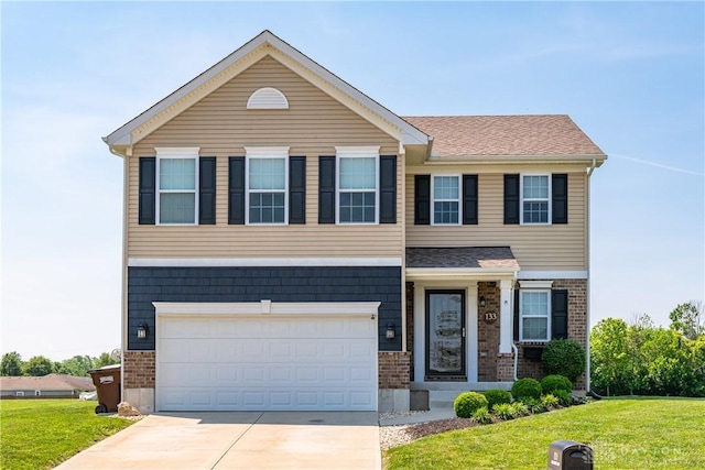 133 Followers Way, Waynesville, OH 45068 - view of front of property with a front yard, an attached garage, concrete driveway, and brick siding