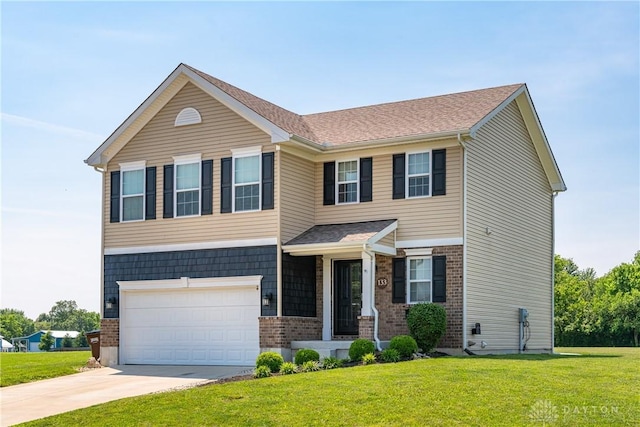 133 Followers Way, Waynesville, OH 45068 - view of front facade featuring an attached garage, a front yard, driveway, and brick siding