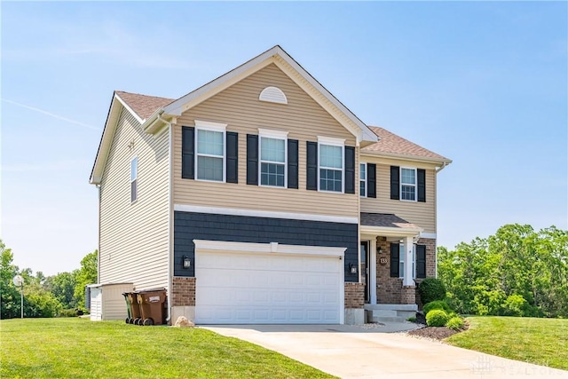 133 Followers Way, Waynesville, OH 45068 - view of front facade with a garage, a front yard, driveway, and brick siding
