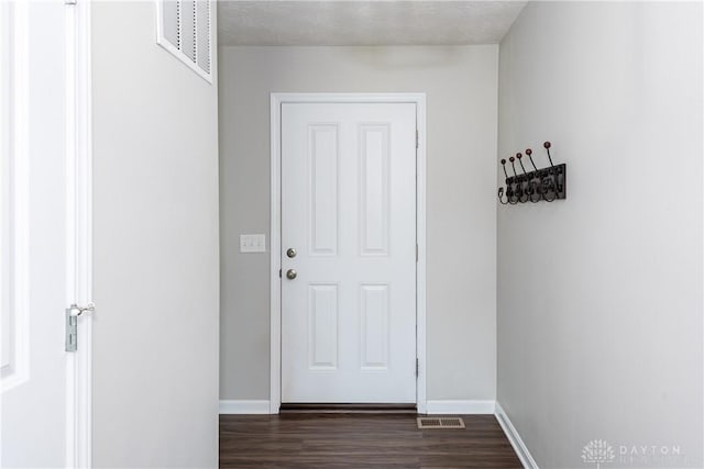133 Followers Way, Waynesville, OH 45068 - entryway featuring dark wood finished floors and baseboards