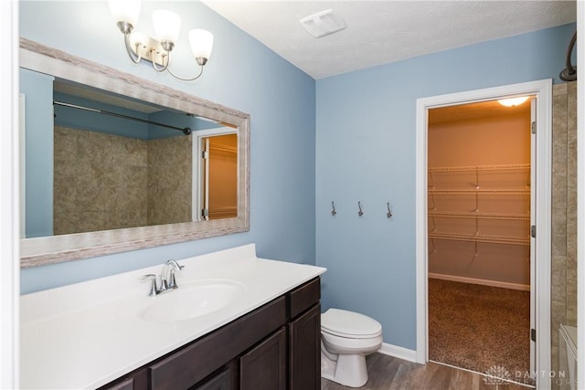 133 Followers Way, Waynesville, OH 45068 - full bath featuring vanity, a walk in closet, wood finished floors, and a shower