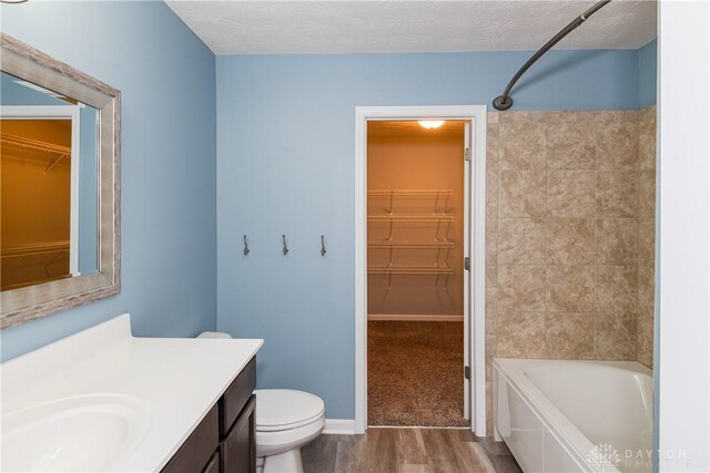 133 Followers Way, Waynesville, OH 45068 - full bath with vanity, a walk in closet,  shower combination, and wood finished floors