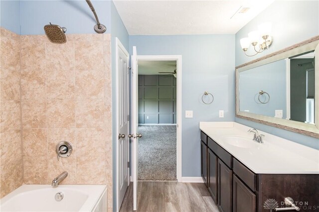 133 Followers Way, Waynesville, OH 45068 - bathroom featuring vanity, wood finished floors, and  shower combination