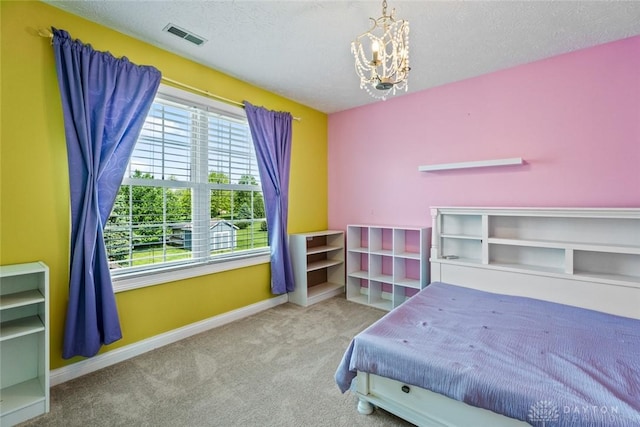 1737 Wilmington Rd, Cedarville Twp, OH 45314 - carpeted bedroom with a chandelier and a textured ceiling