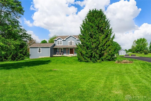 1737 Wilmington Rd, Cedarville Twp, OH 45314 - view of front of home featuring a front lawn, a porch, and an outbuilding