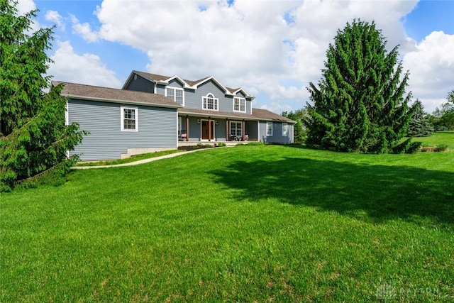 1737 Wilmington Rd, Cedarville Twp, OH 45314 - view of front facade with covered porch and a front lawn