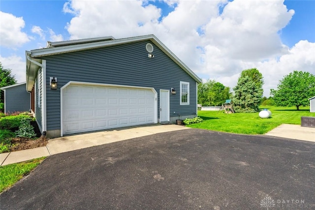1737 Wilmington Rd, Cedarville Twp, OH 45314 - view of property exterior featuring a playground, a lawn, and a garage