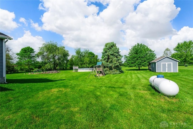 1737 Wilmington Rd, Cedarville Twp, OH 45314 - view of green lawn featuring a playground and a storage unit