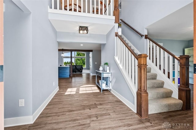 1737 Wilmington Rd, Cedarville Twp, OH 45314 - entrance foyer with wood finished floors, stairway, and a towering ceiling