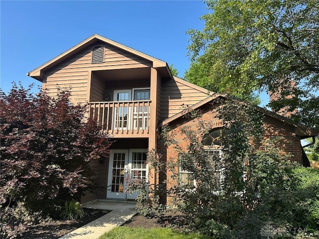 6553 Stillcrest Way, Dayton, OH 45414 - back of house with a balcony, brick siding, and french doors