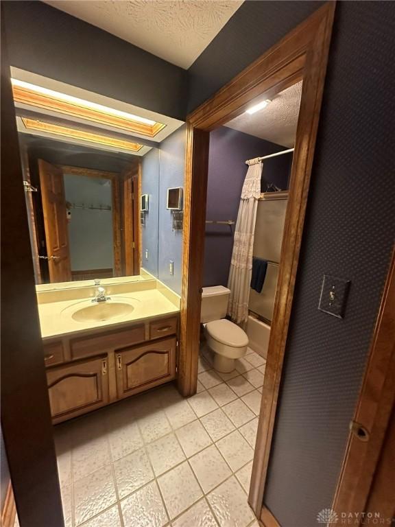 6553 Stillcrest Way, Dayton, OH 45414 - full bathroom with vanity, shower / bath combo, and tile patterned floors