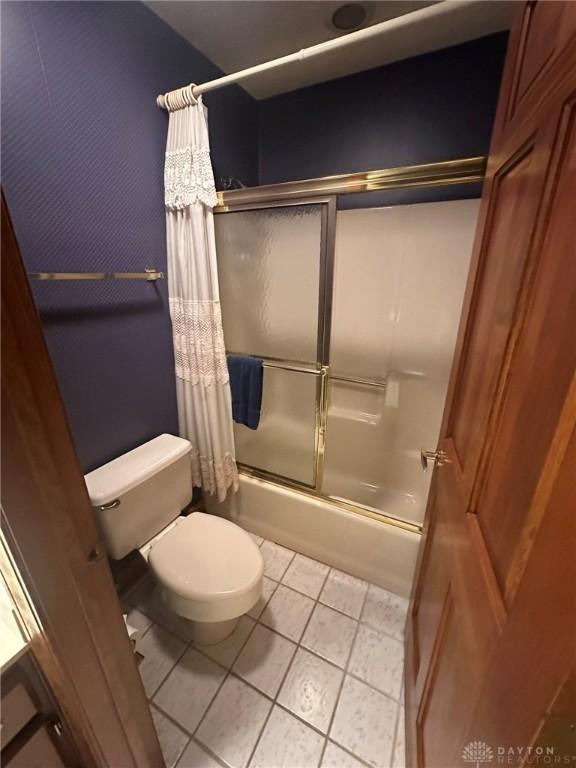6553 Stillcrest Way, Dayton, OH 45414 - bathroom with shower / bath combination with glass door and tile patterned flooring