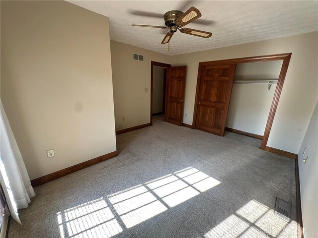 6553 Stillcrest Way, Dayton, OH 45414 - unfurnished bedroom with light carpet, a closet, and a ceiling fan