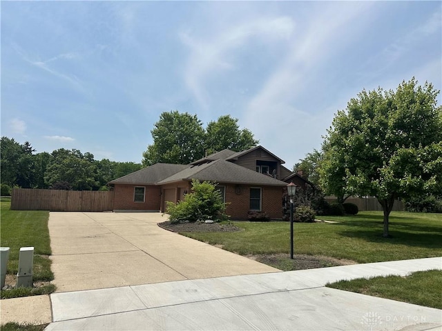 6553 Stillcrest Way, Dayton, OH 45414 - view of front of house featuring driveway, a garage, and brick siding