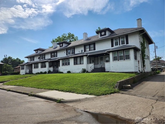 953 Five Oaks Ave Unit 943, Dayton, OH 45406 - view of front of home with a chimney and a front lawn