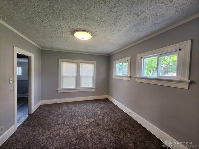 953 Five Oaks Ave Unit 943, Dayton, OH 45406 - spare room featuring crown molding, dark colored carpet, and a textured ceiling