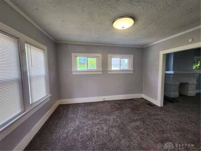 953 Five Oaks Ave Unit 943, Dayton, OH 45406 - unfurnished bedroom featuring dark carpet, crown molding, a textured ceiling, and a fireplace