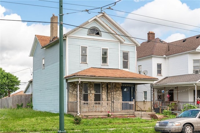 2241 E 3rd St, Dayton, OH 45403 - view of front facade with a porch and stone siding