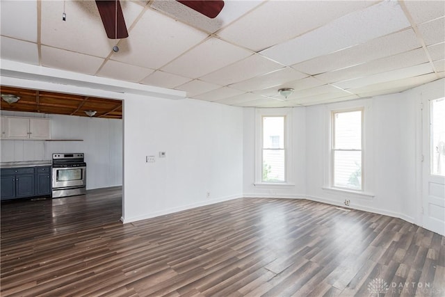 2241 E 3rd St, Dayton, OH 45403 - unfurnished living room with a drop ceiling, dark wood finished floors, plenty of natural light, and ceiling fan