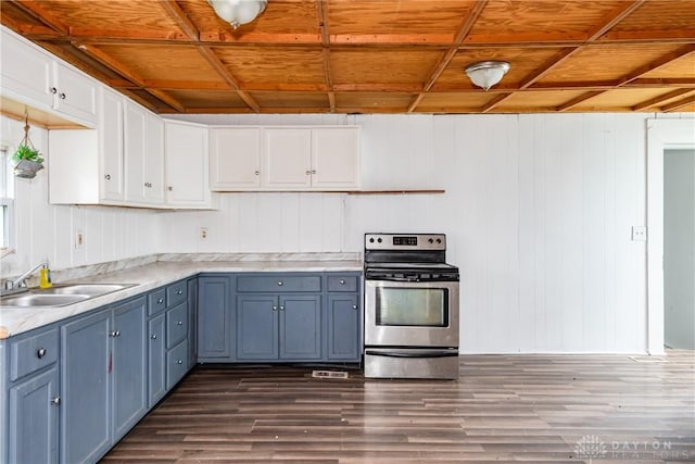 2241 E 3rd St, Dayton, OH 45403 - kitchen featuring stainless steel electric range oven, dark wood-style floors, white cabinetry, light countertops, and blue cabinets