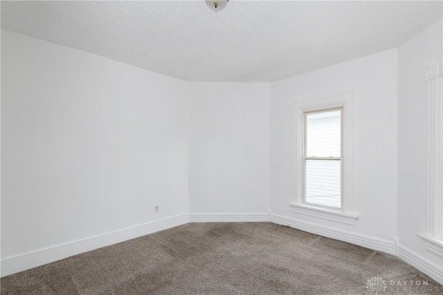 2241 E 3rd St, Dayton, OH 45403 - unfurnished room featuring carpet and baseboards