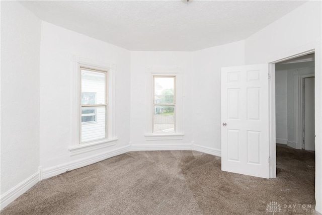 2241 E 3rd St, Dayton, OH 45403 - carpeted spare room with baseboards
