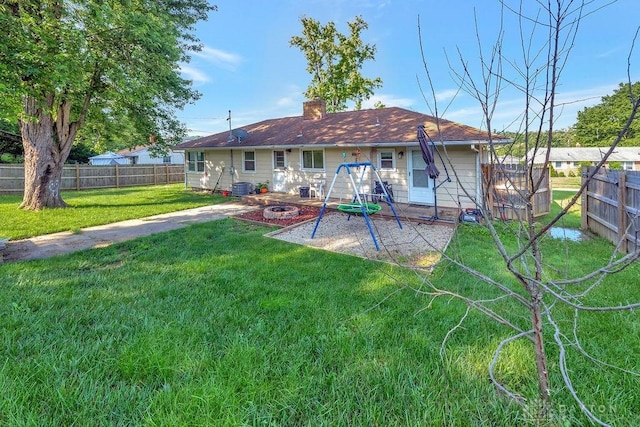 1210 Clovernook Dr, Hamilton, OH 45013 - back of house with an outdoor fire pit, a fenced backyard, a chimney, and a patio area