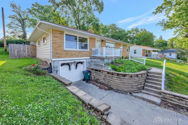 1210 Clovernook Dr, Hamilton, OH 45013 - ranch-style house featuring an attached garage, a front yard, brick siding, and stairs