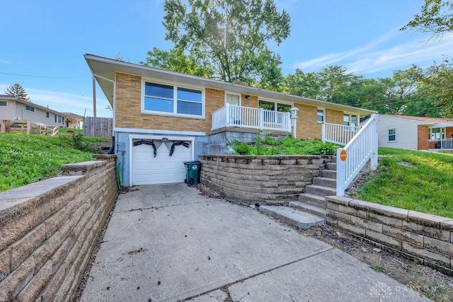 1210 Clovernook Dr, Hamilton, OH 45013 - ranch-style home featuring a garage, driveway, stairway, and brick siding