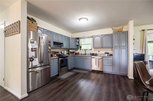 10452 S Union Rd, Miamisburg, OH 45342 - kitchen featuring stainless steel appliances, gray cabinets, dark wood-style flooring, and healthy amount of natural light