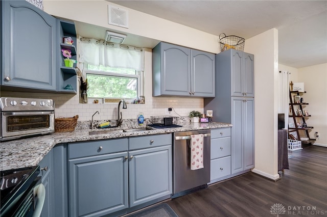 10452 S Union Rd, Miamisburg, OH 45342 - kitchen with stainless steel dishwasher, range, dark wood finished floors, and tasteful backsplash
