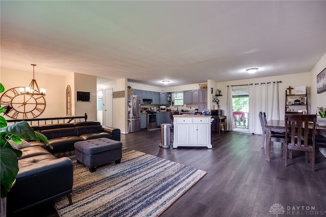 10452 S Union Rd, Miamisburg, OH 45342 - living room featuring dark wood finished floors and a chandelier