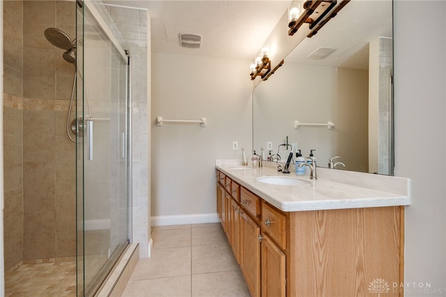 243 Woodside Trl, Clearcreek Twp, OH 45036 - bathroom featuring double vanity, a tile shower, and tile patterned flooring