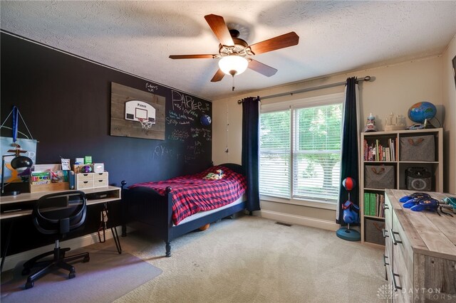 243 Woodside Trl, Clearcreek Twp, OH 45036 - carpeted bedroom with an office area, a textured ceiling, and a ceiling fan