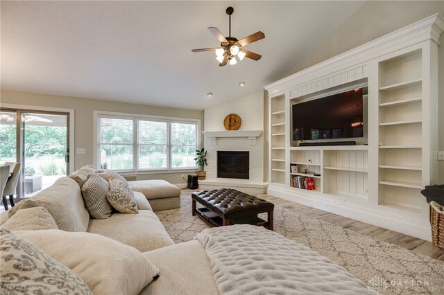 243 Woodside Trl, Clearcreek Twp, OH 45036 - living area featuring plenty of natural light, ceiling fan, wood finished floors, lofted ceiling, and built in features